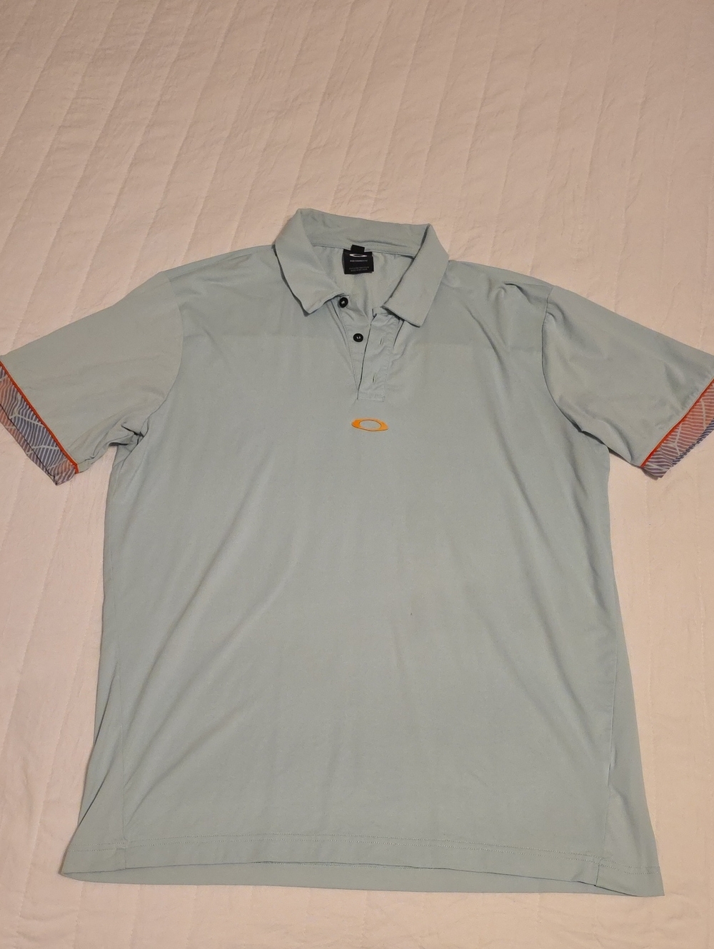 Oakley Men's Pale Blue Polo with Orange Logo Accents
